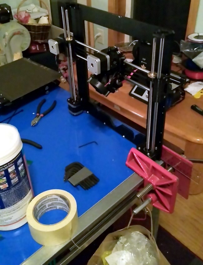 Z-axis leadscrews & rails are attached to the frame.