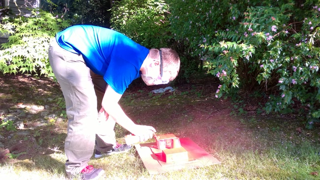 Spray painting the swood box.