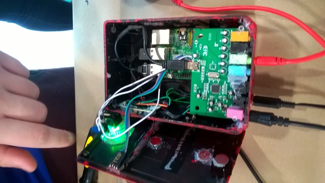 The internals of the swood box. A sound card, Raspberry Pi, power converter, and more were crammed into the project enclosure.