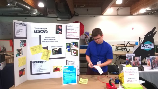 Setting up the swood table at Maker Faire. Double-checking the written materials I prepared beforehand.