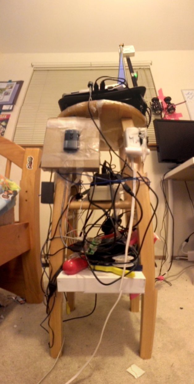 This 'tower' of a couple spare extenal hard drives, Arduinos, and a laptop powered the Watson system.